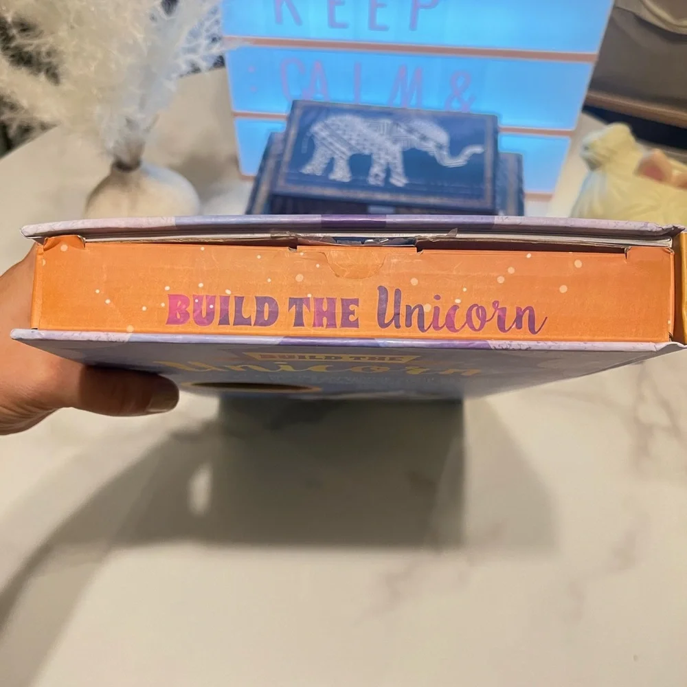 Build the Unicorn Kids Building Set, reading book, and Lear